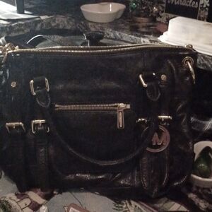 I am selling this wonderful purse, due to fact I have too many.